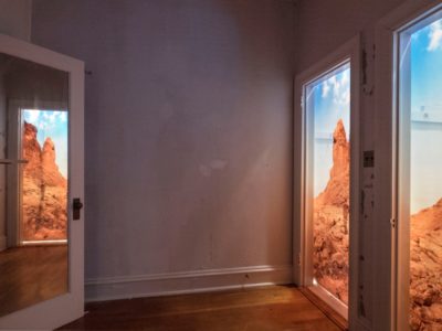 Installation with mirrors to create 3Dviewing of lightbox doorways
